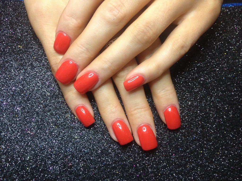 Acrylic nails with red gel polish