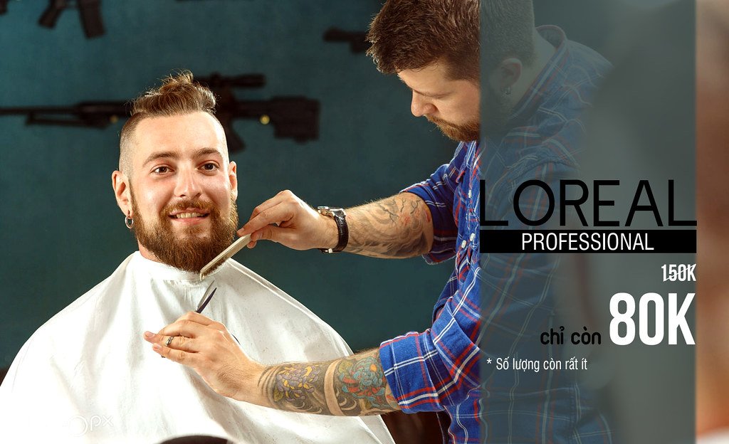 Man getting his beard shaved in a barber shop