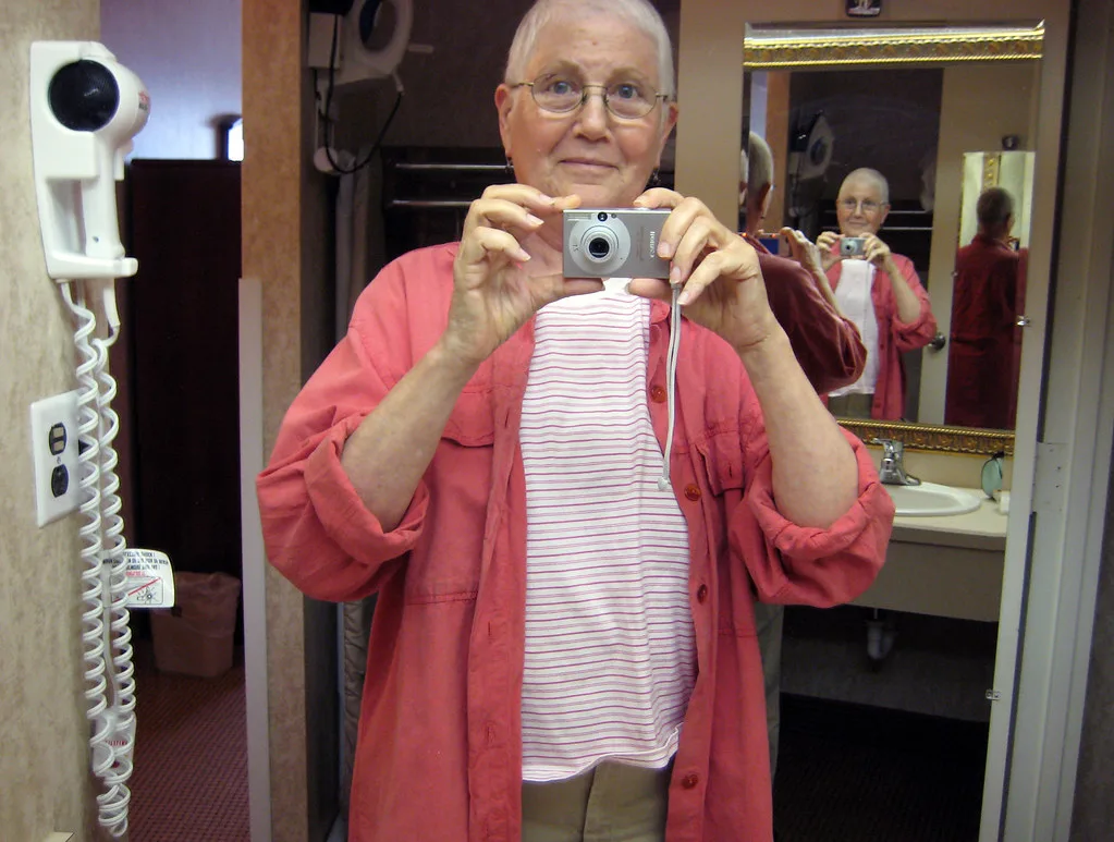 quadruple self-portrait with hair dryer