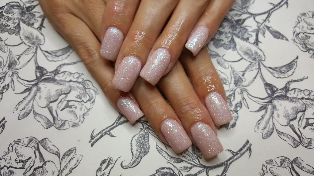 Acrylic nails with nude and glitter dust