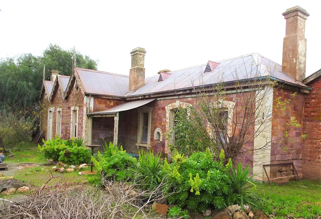 Eudunda. The sad ruins of the triple gabled Eudunda railway station. Built in pink sandstone in 1879