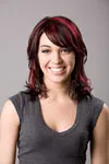 Medium length, dark hair with red highlights