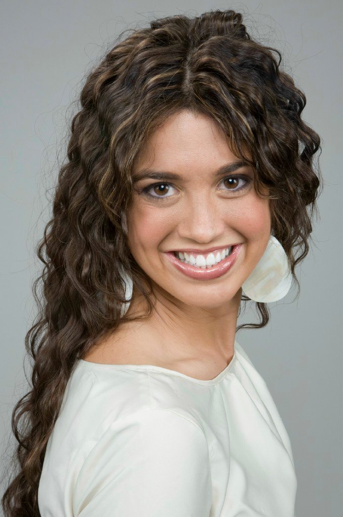Long, curly brown hair  with highlights