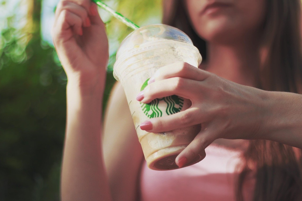 iced coffee, flurry, drink, softdrink, dessert, beverage, coffee, takeaway, cup, plastic, refreshment, snack, starbucks, coffee cup, hands, nail polish, young, girl