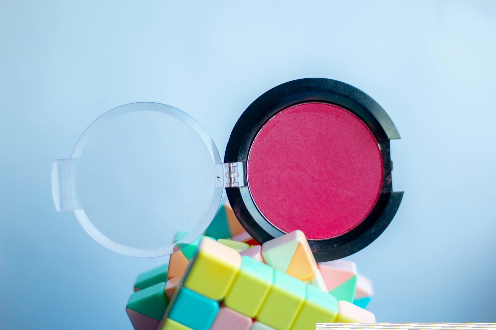 a close up of a pink powder on a pile of rubs