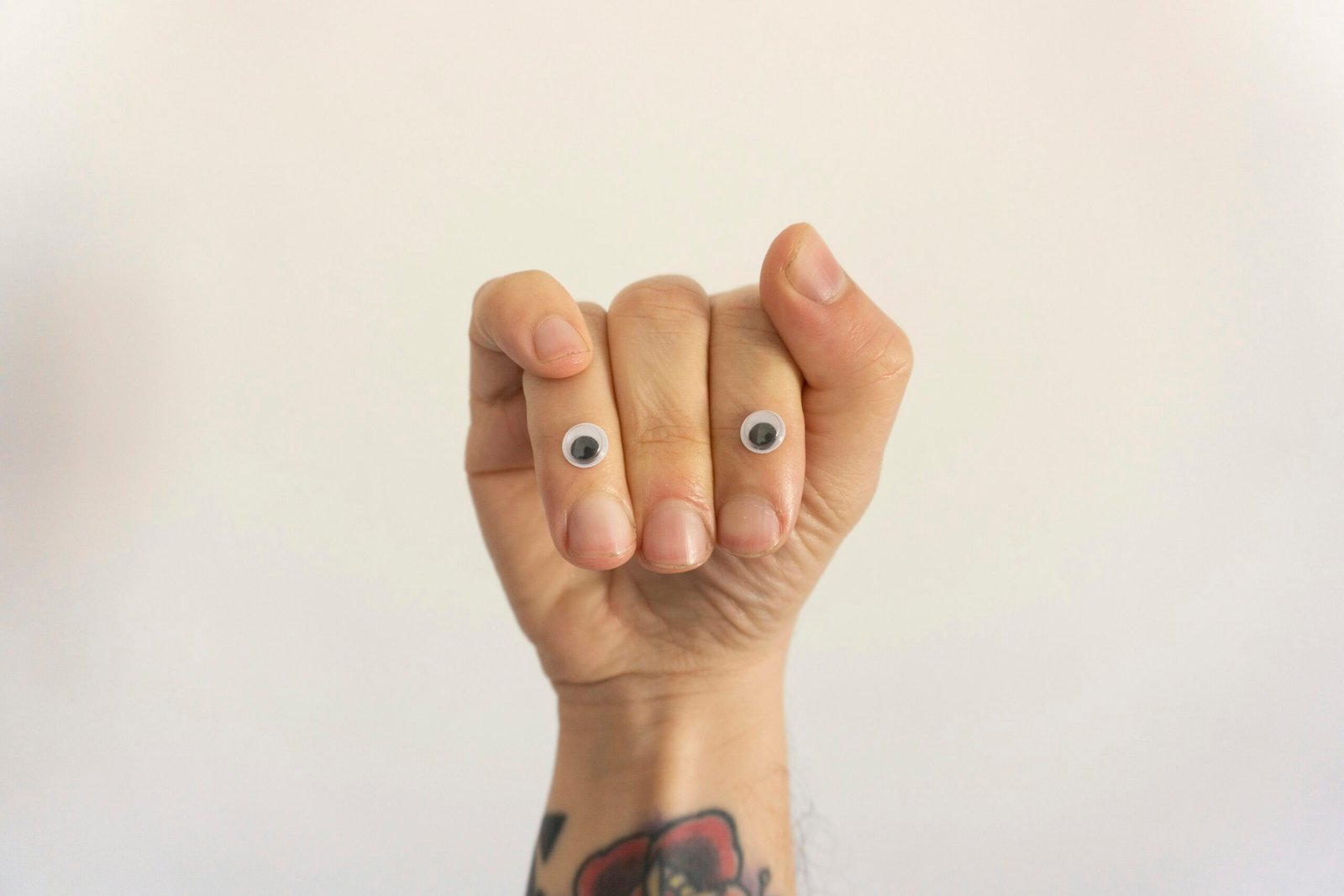 person with black and red manicure
