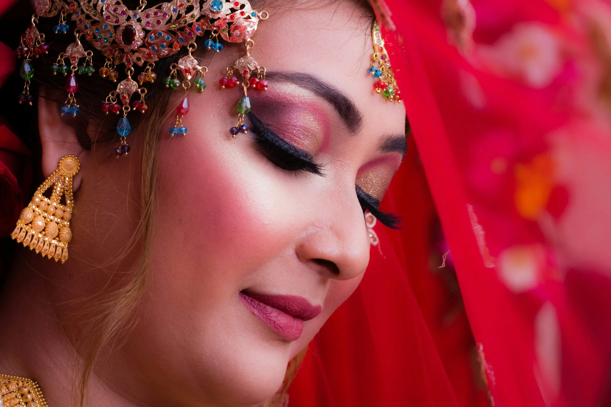 woman with red lipstick and black eyeshadow