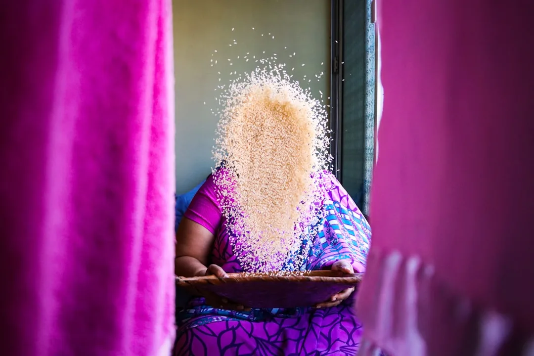 woman in purple dress sitting on purple textile