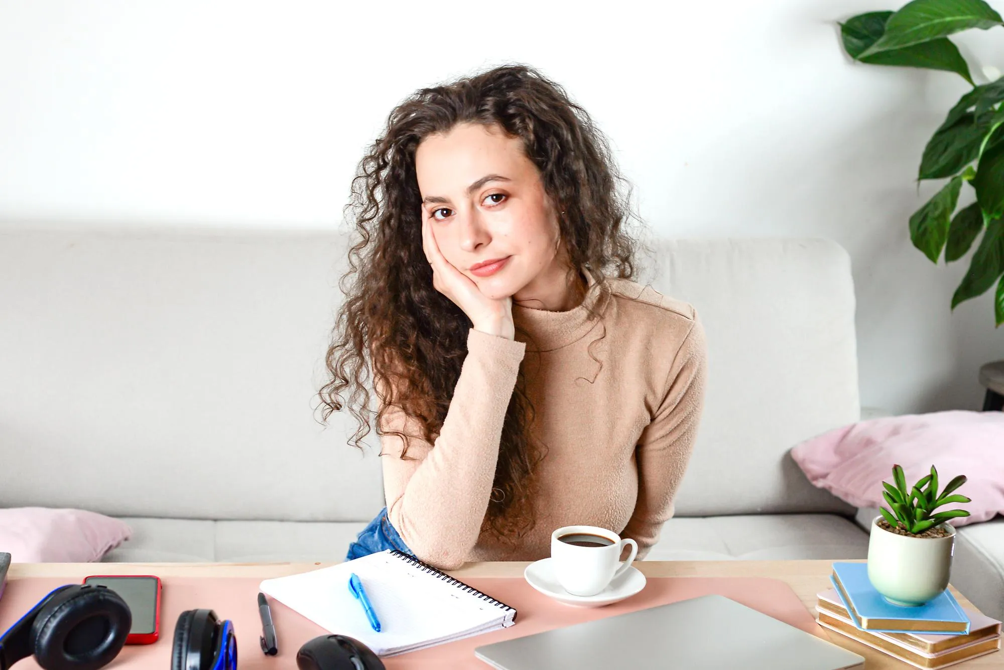 A Charming Young Woman Found in a Cozy Home Office Setting that is Inviting and Modern