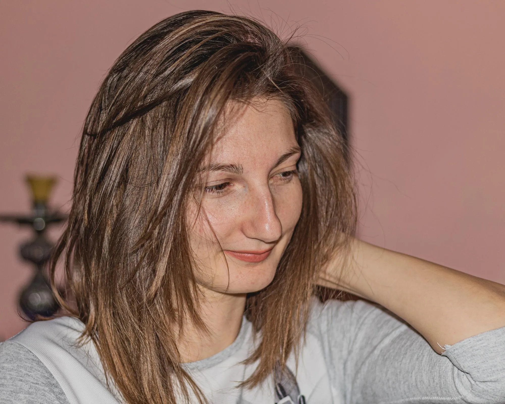 Close-up of smiling young woman at home