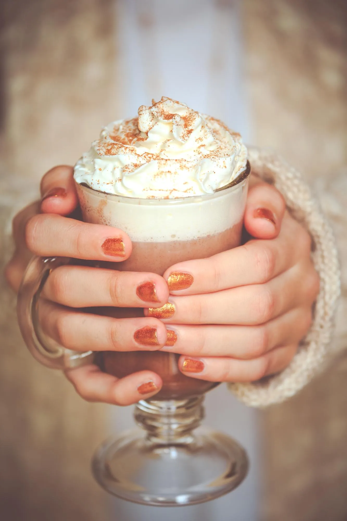 Close-up of woman holding coffee cup