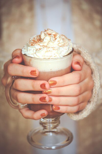 Close-up of woman holding coffee cup