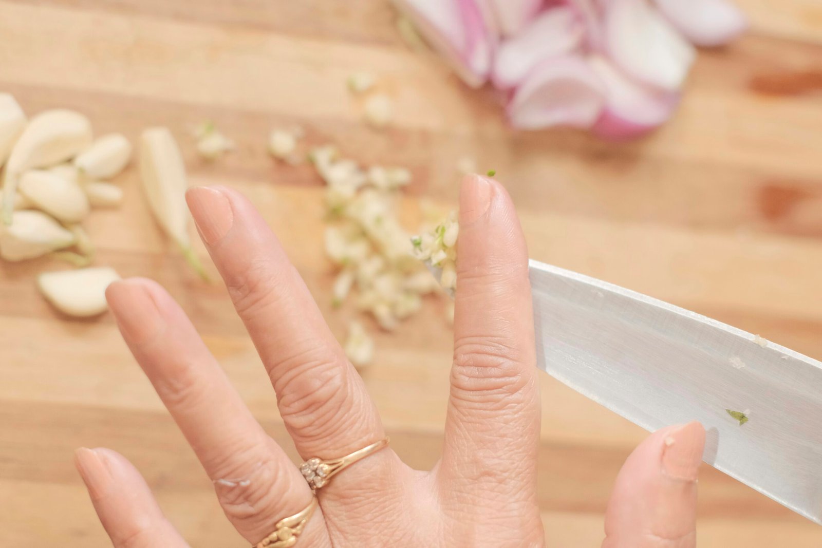 a woman is holding a knife in her hand