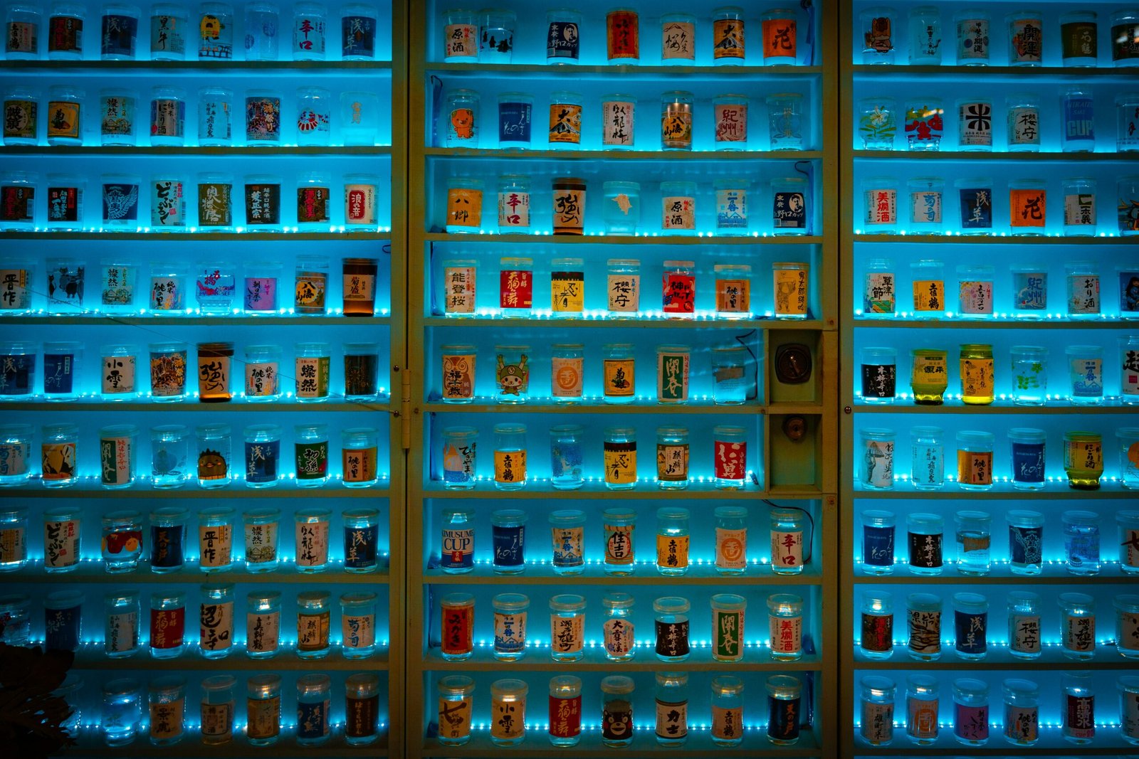 a large display case filled with lots of bottles