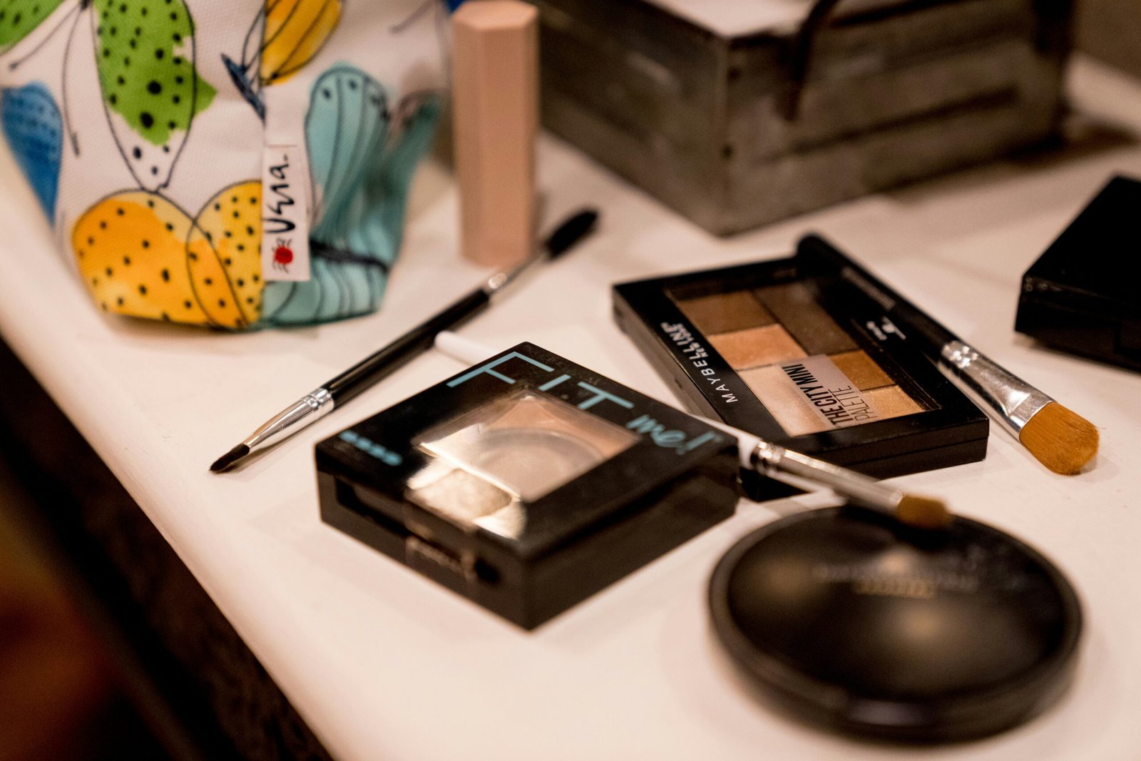 a table with a phone and other objects on it