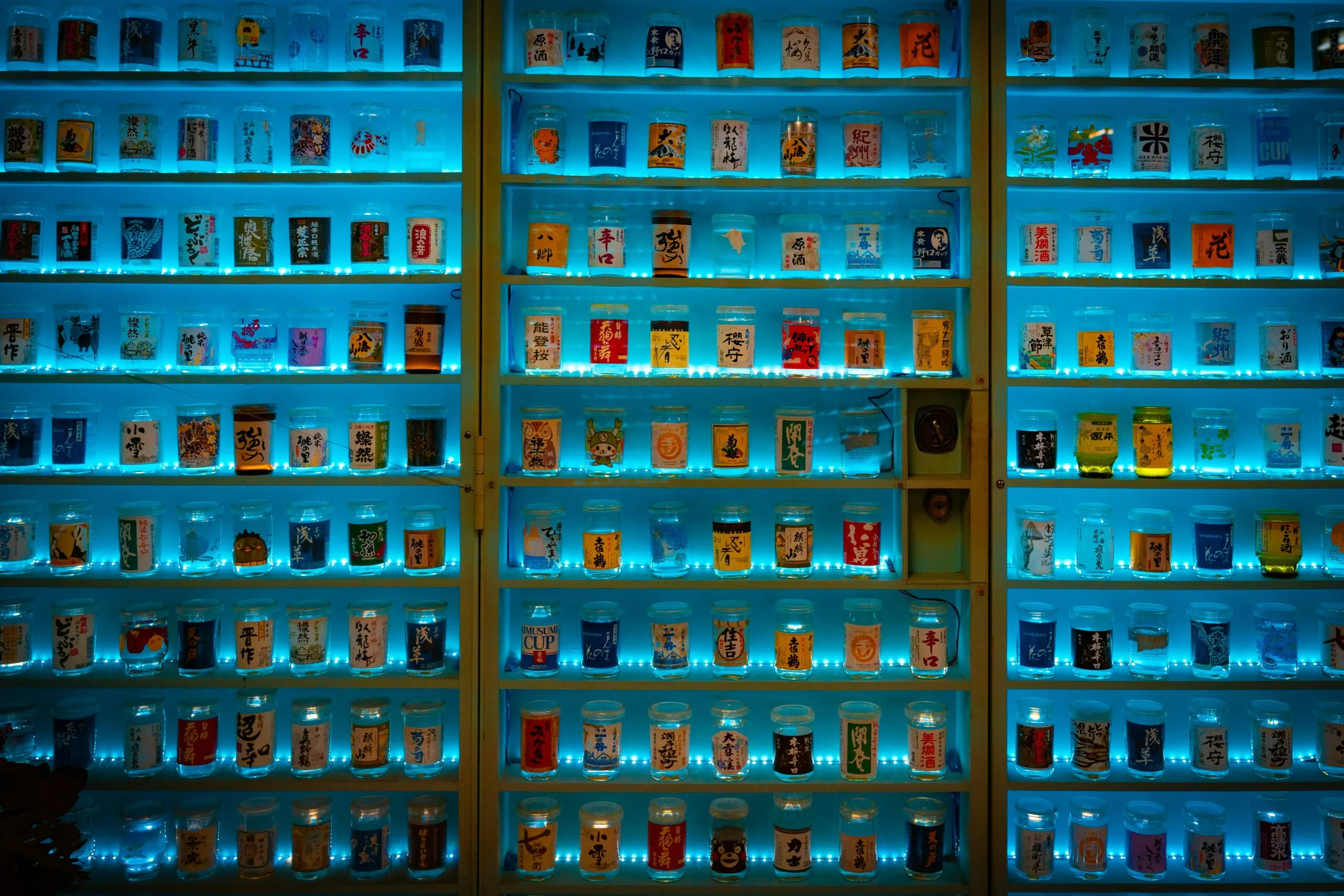 a large display case filled with lots of bottles