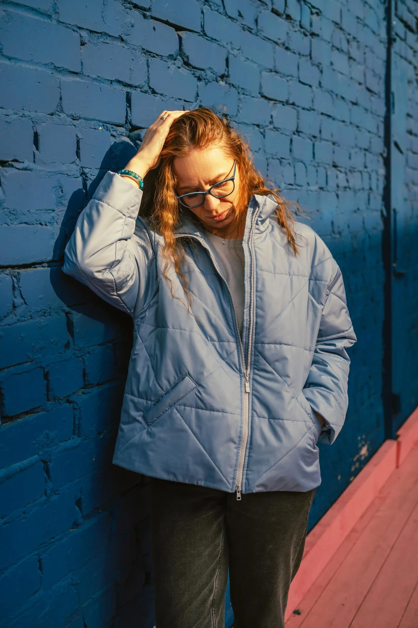 Portrait of a stylish woman in blue jacket spring outdoor portrait