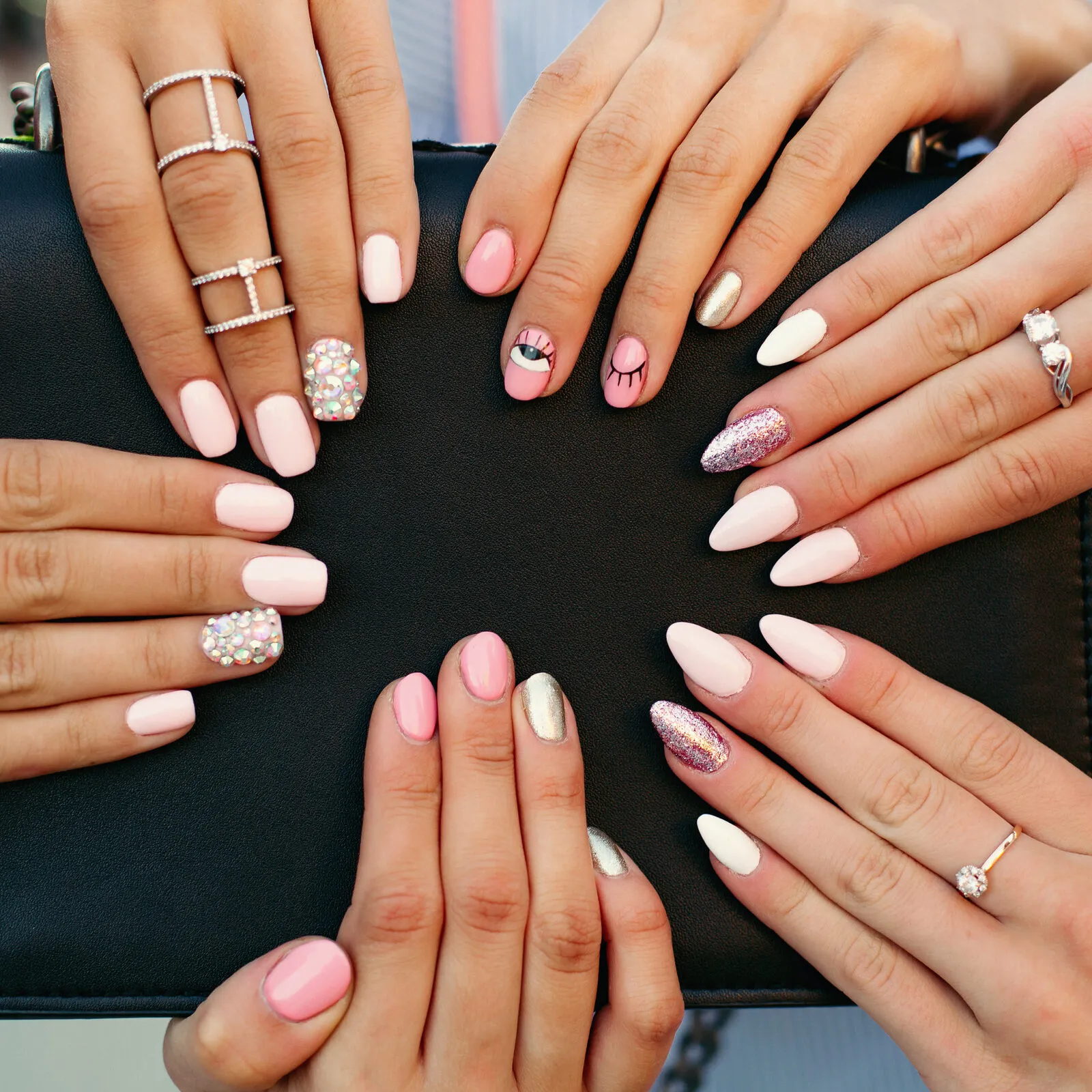 Different fashionable and trendy manicure with design on woman s hands.