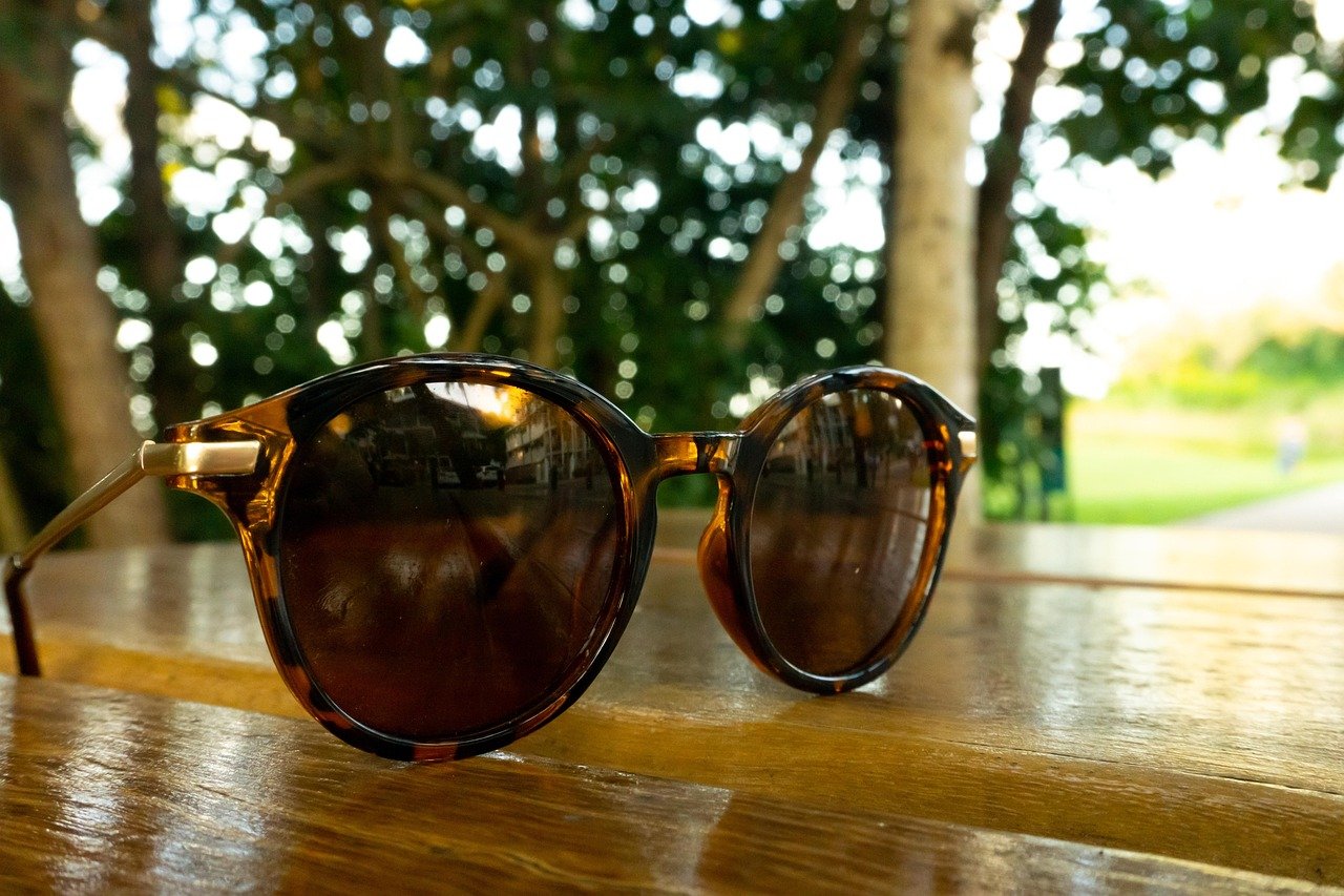 sunglasses, beach, forest, summer, sand, vacation, travel, bikini, sea, woman, sun, holiday, eyewear, nature, sunshine, vacations, sunscreen, swimsuit, relax, ocean, girl, table, tree, outdoors