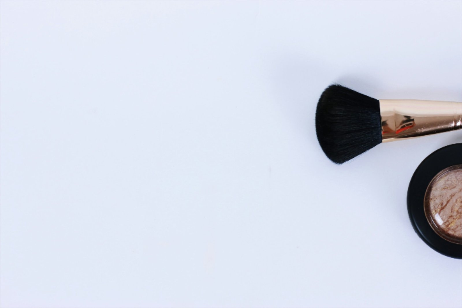 black brush on white surface