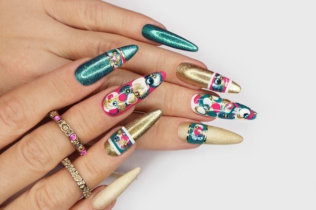 Nail art on long oval nails with gold varnish