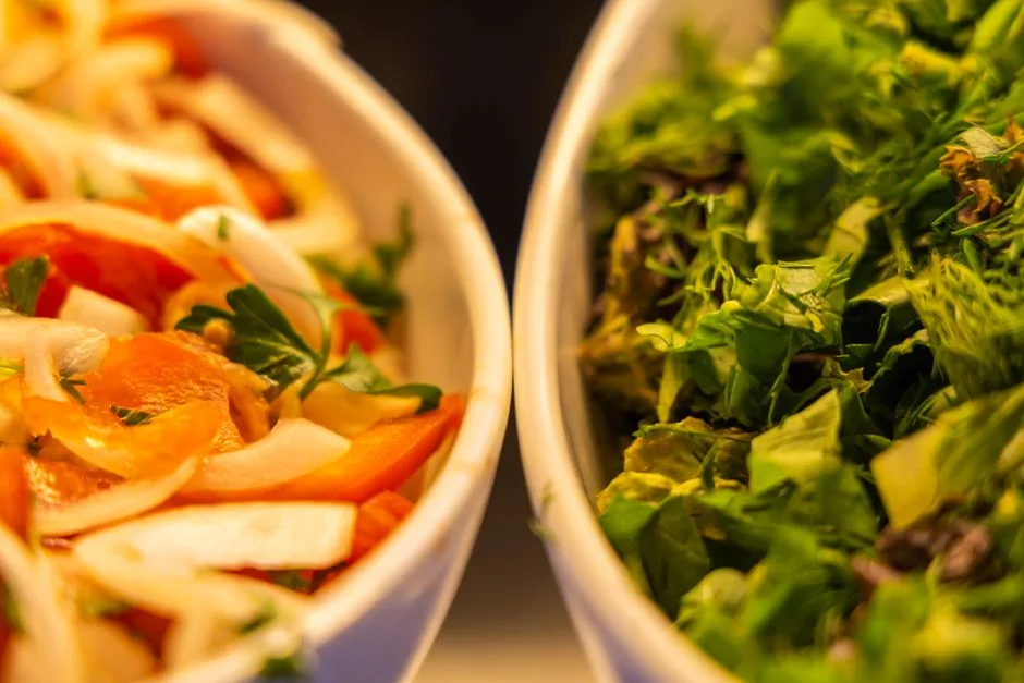 Colorful vegan salads featuring fresh vegetables in close-up for healthy eating inspiration.