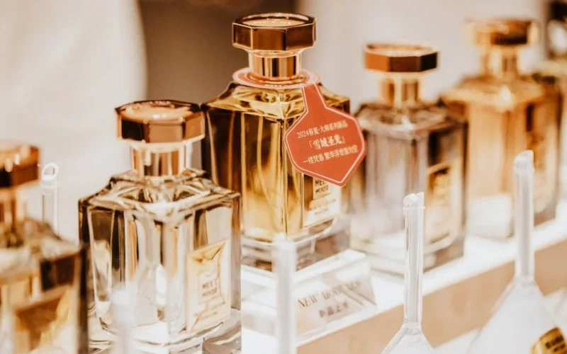 Elegant collection of perfume bottles showcasing luxury fragrances in a stylish retail display.